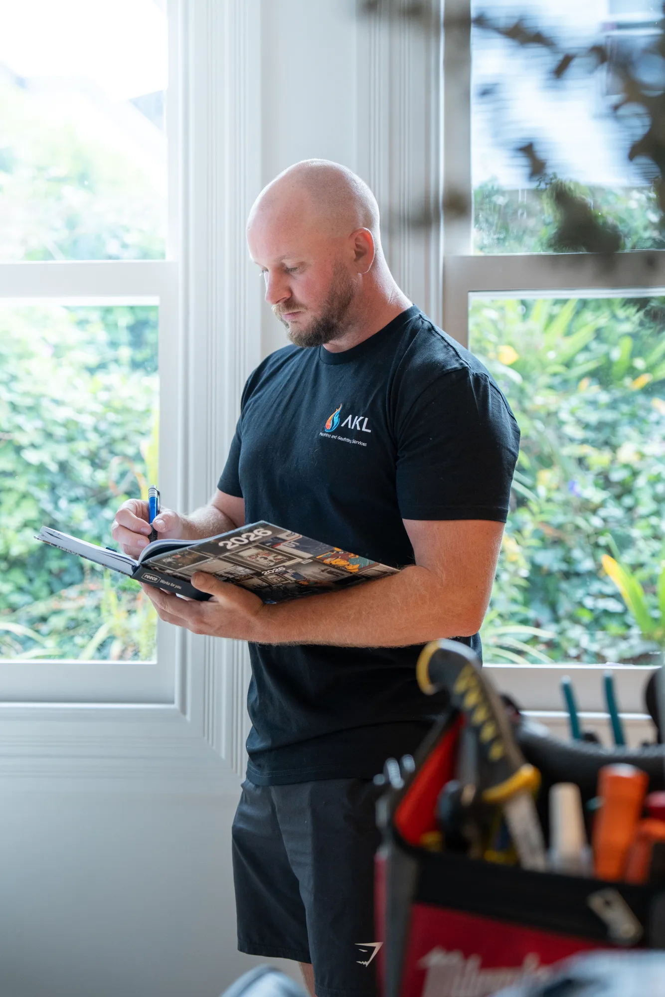 AKL Plumbing reviewing plans in client home